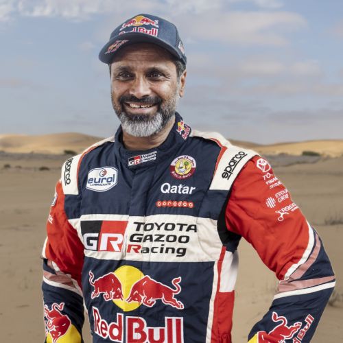 Team 1, Car 200 Driver Nasser Al-Attiyah with hands on hipe smiling to camera